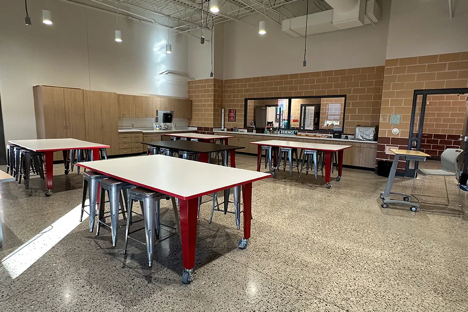 Group tables with silver stools in a lab