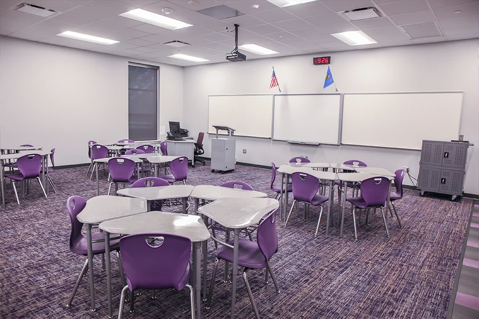 A classroom with groups of desks