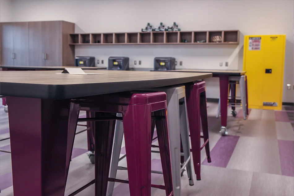 Purple and silver stools under a lab table