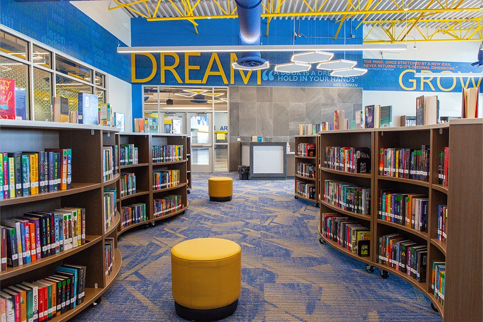 A library aisle between two bookshelves