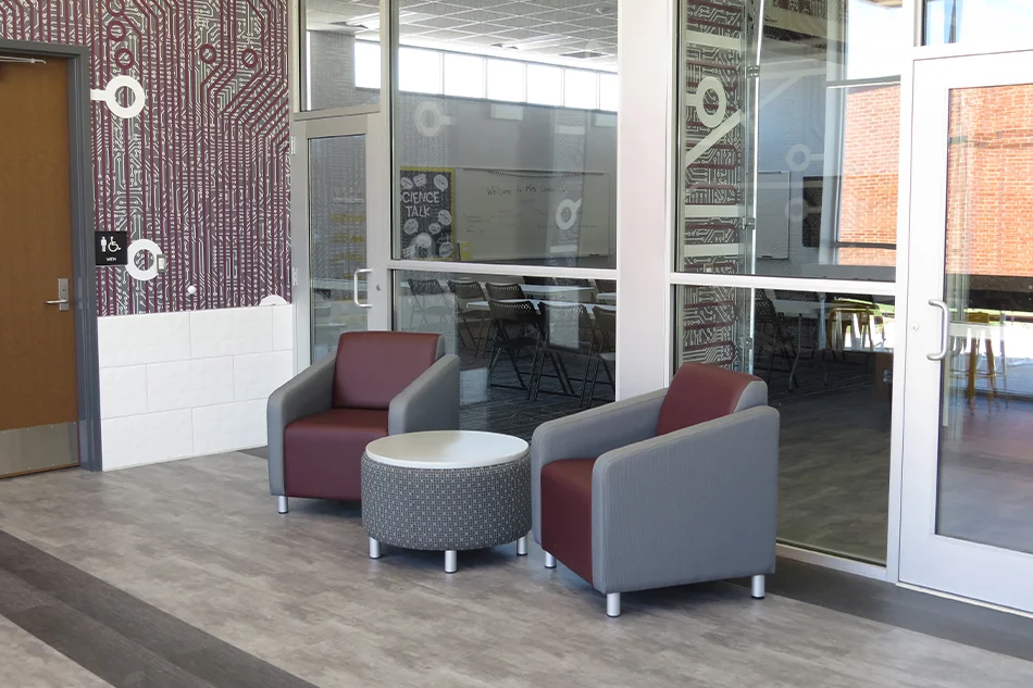 Two chairs with a ottoman table in the middle