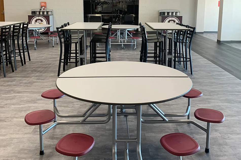 A school lunchroom table with attached stools