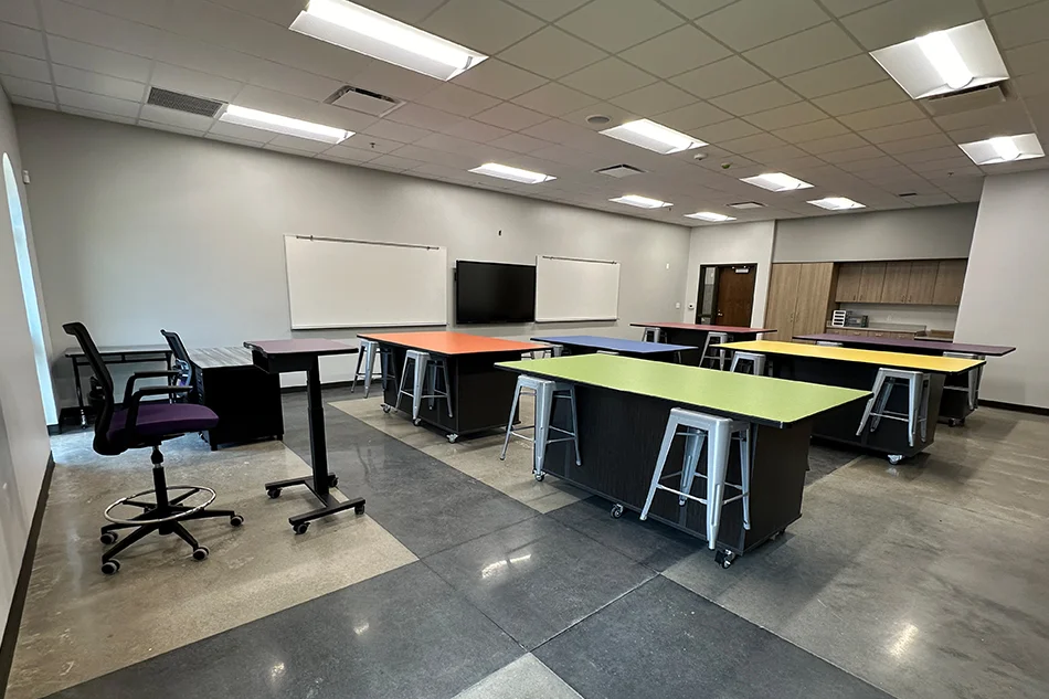 A science lab with student tables and stools