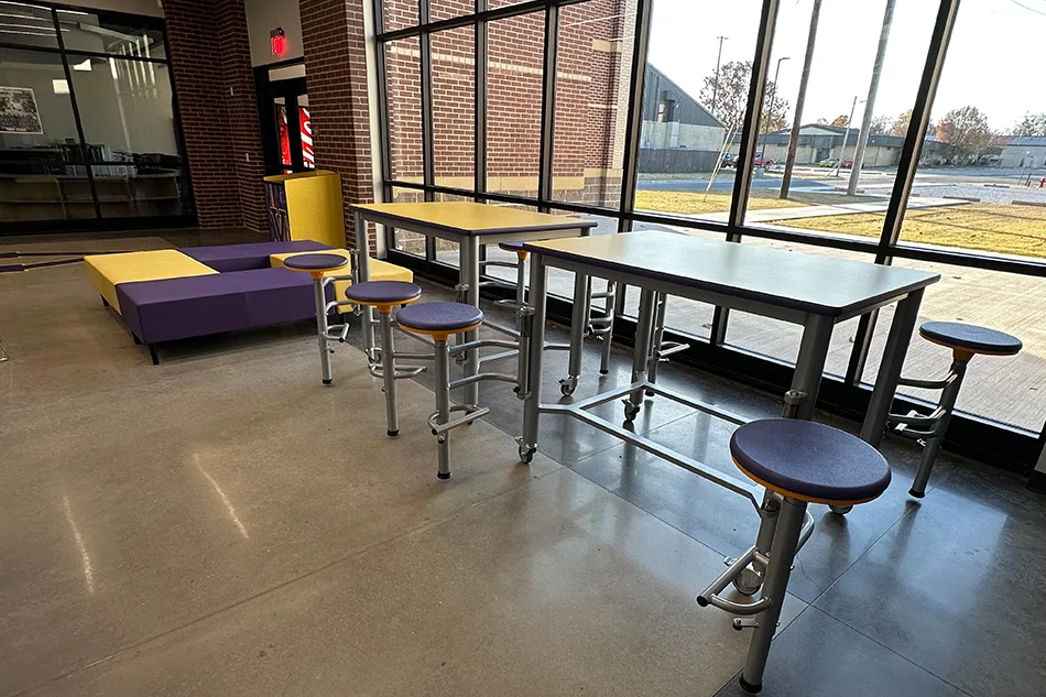 Student seating in front of a large window
