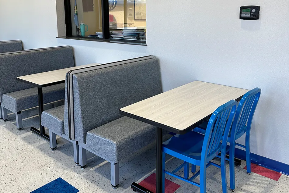 Group tables with silver stools in a lab