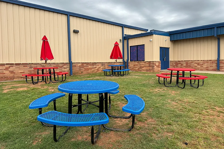 Group tables with silver stools in a lab