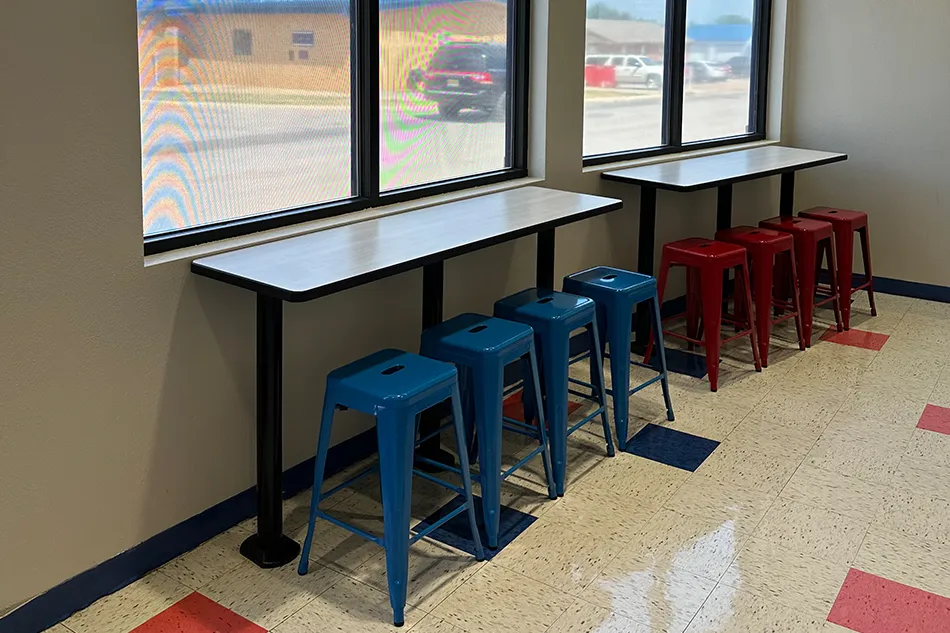 Group tables with silver stools in a lab