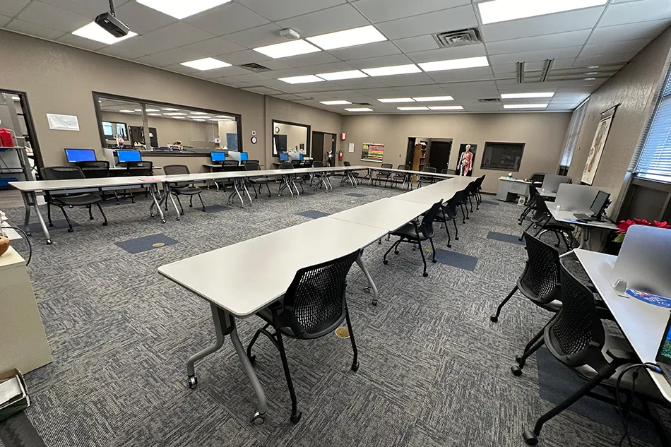 Group tables with silver stools in a lab