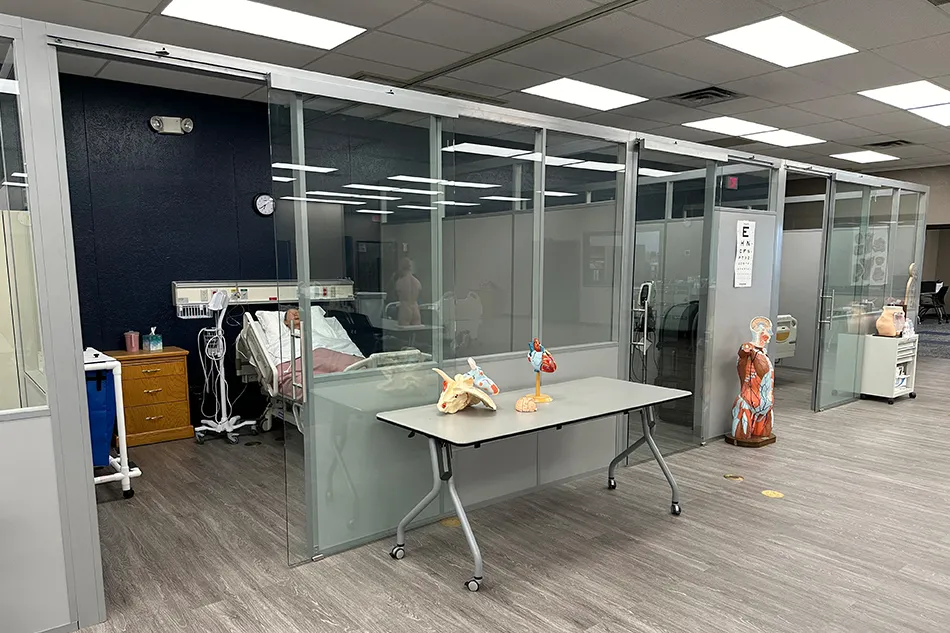 Multiple chairs with small tables in a common area