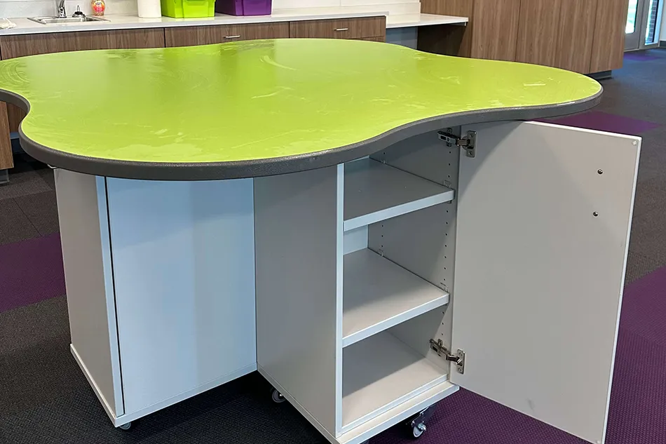 Group tables with silver stools in a lab