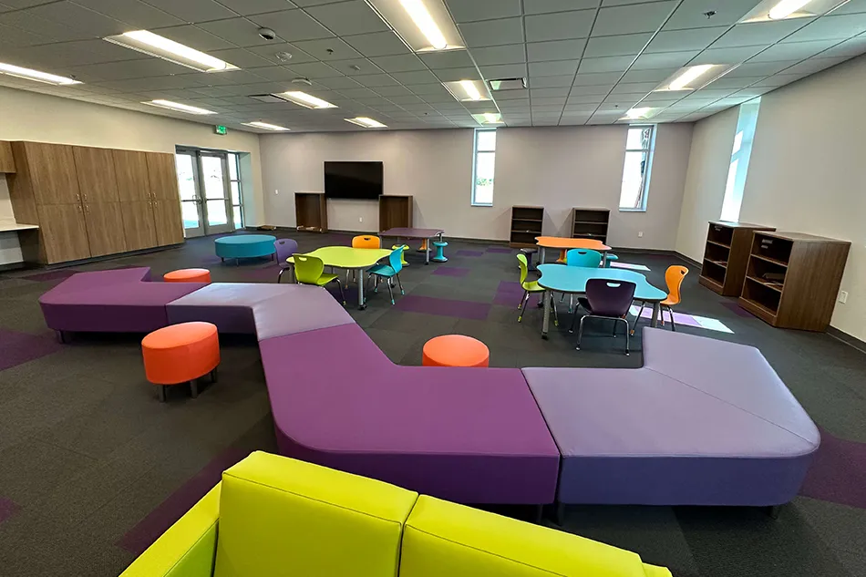 Group tables with silver stools in a lab