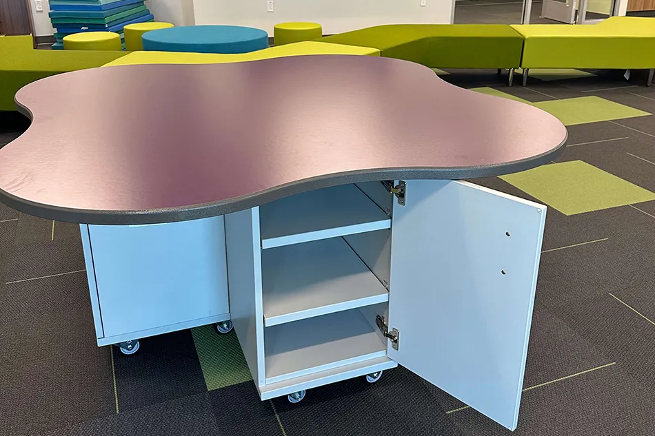 Group tables with silver stools in a lab