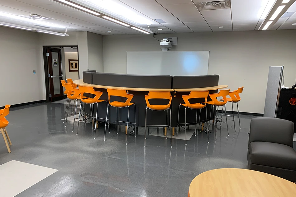 A curved couch in a student common area