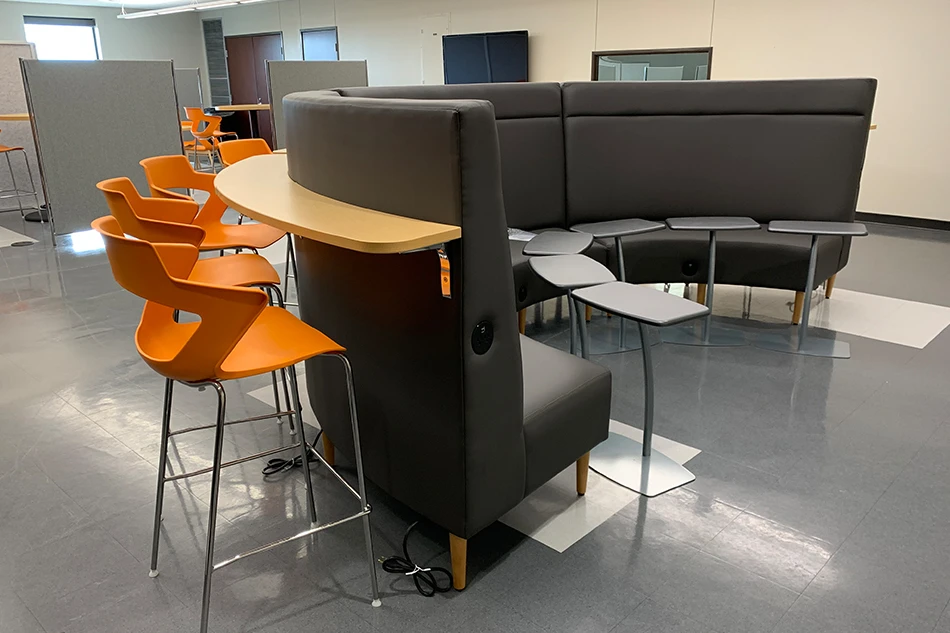 Group tables with silver stools in a lab