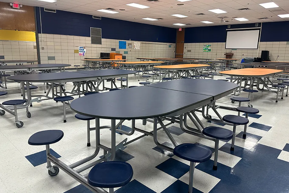 Group tables with silver stools in a lab