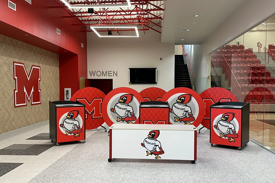 An outdoor trash can with a red bulldog