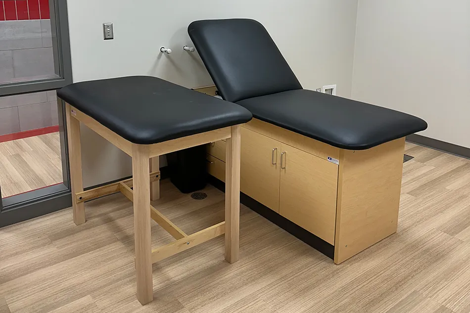 Multiple chairs with small tables in a common area