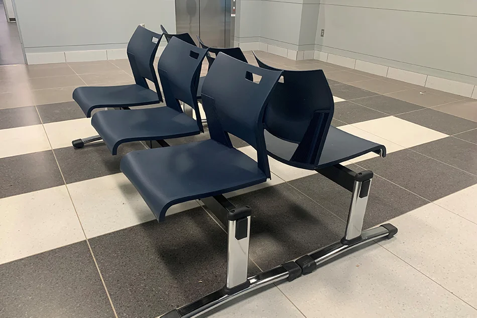 Group tables with silver stools in a lab