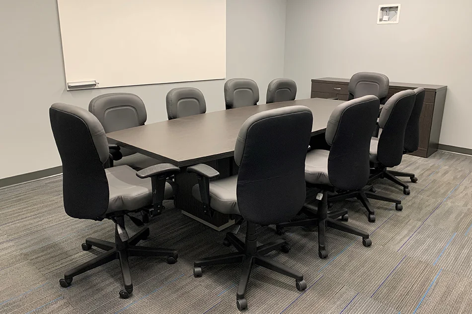 Group tables with silver stools in a lab