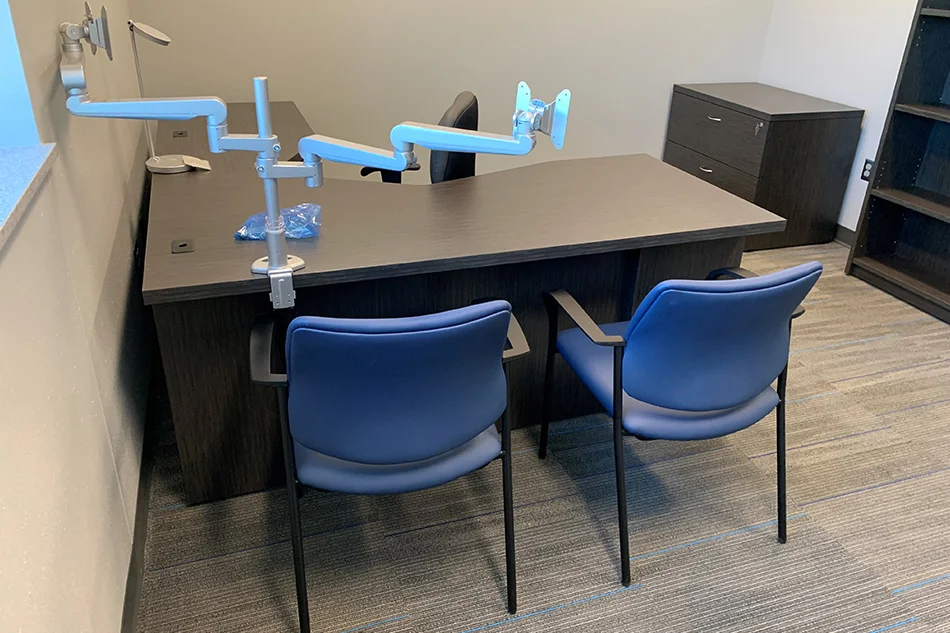 Group tables with silver stools in a lab