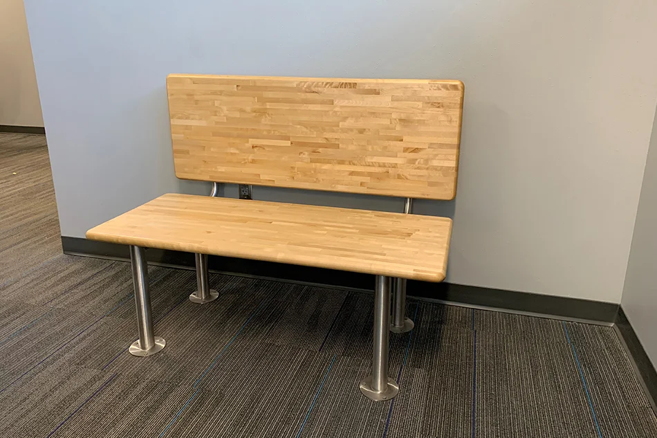 Group tables with silver stools in a lab