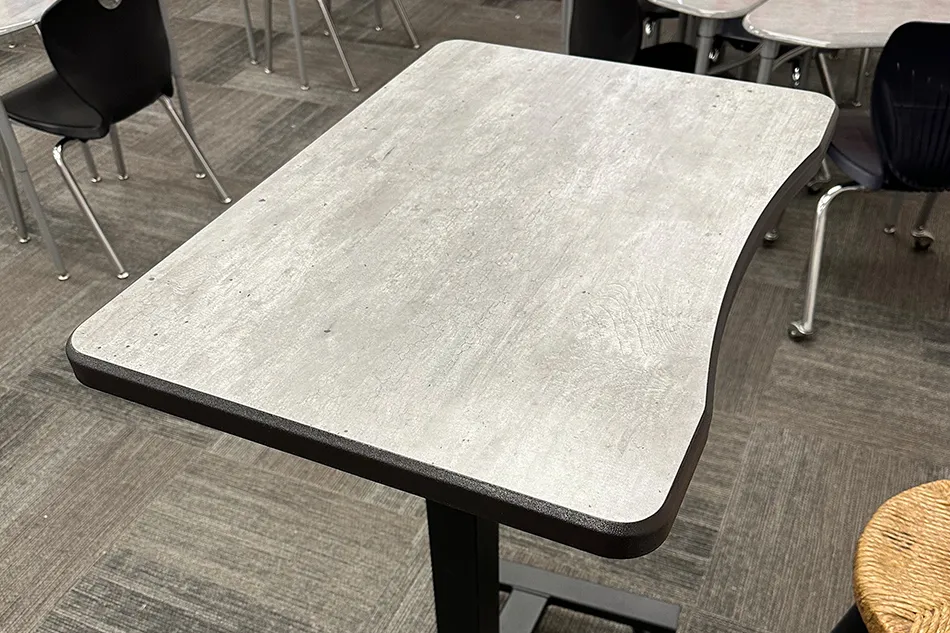 Group tables with silver stools in a lab