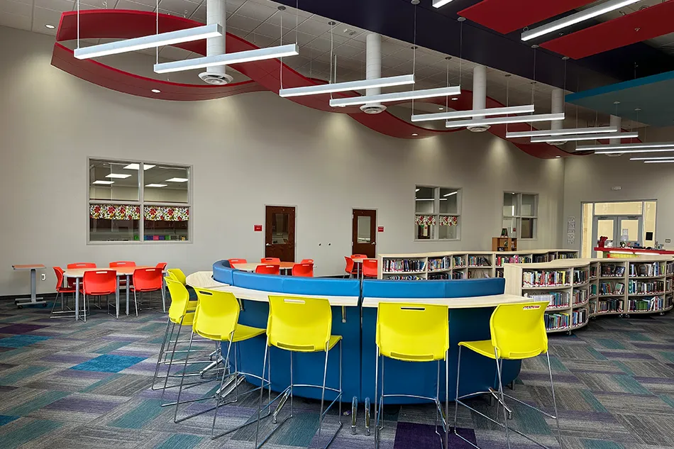 Group tables with silver stools in a lab
