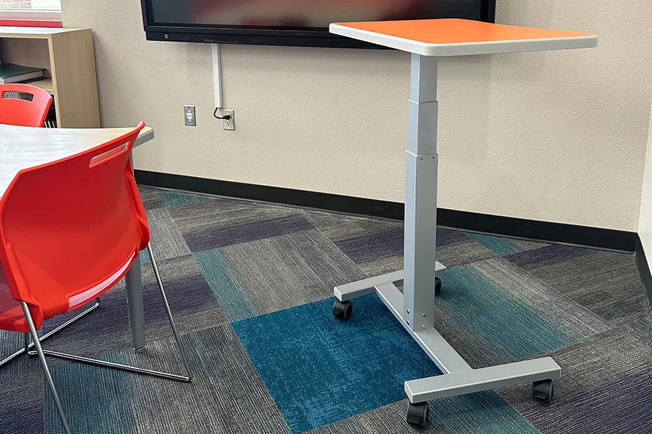 Group tables with silver stools in a lab