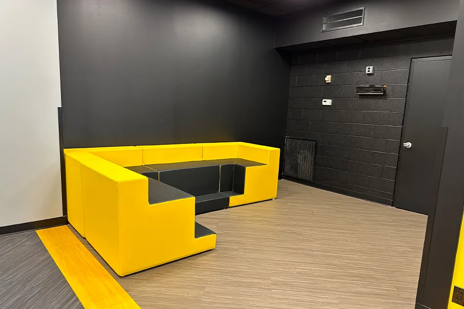 A curved couch in a student common area