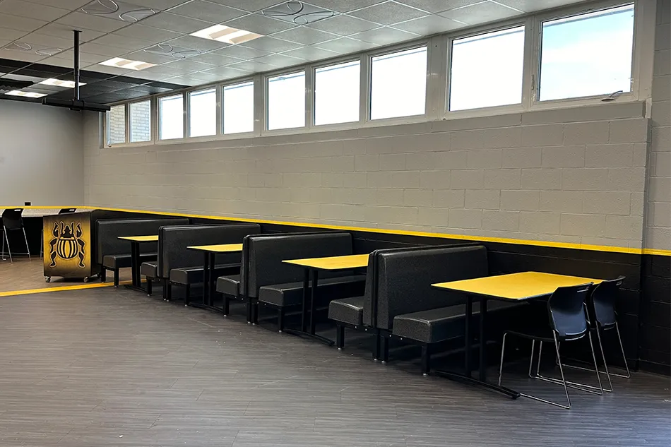 Group tables with silver stools in a lab