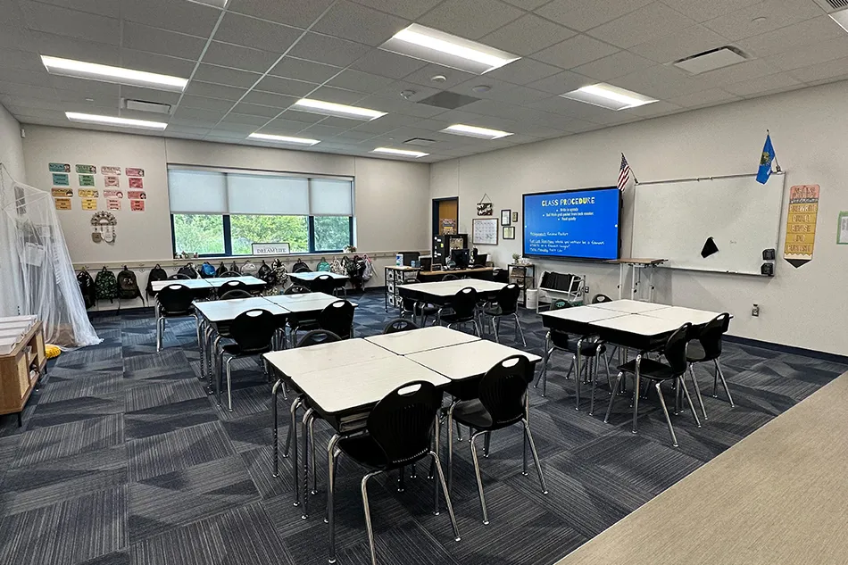 Group tables with silver stools in a lab